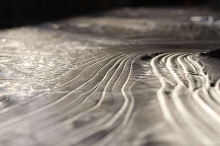 Ice Lake Lines Pattern Surface Background Texture. Wavy Drawings of Ice Lines on a Frozen Lake.