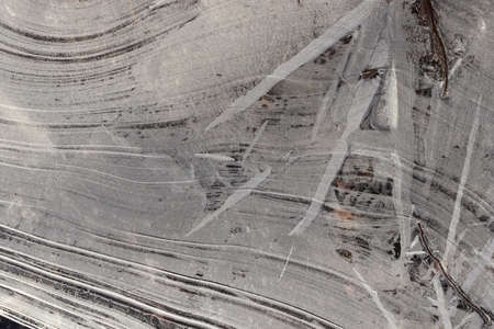 Ice Surface Background Texture. Wavy Drawings of Ice Lines on a Frozen Lake.の写真素材