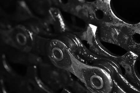 Dirty Bicycle Chain on Gears Texture. Macro Monochrome Closeup Background.の写真素材