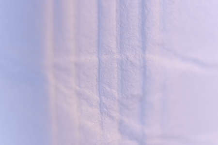 Crumpled Lines on Lilac Paper Texture with Soft Folds. Macro Closeup.の写真素材