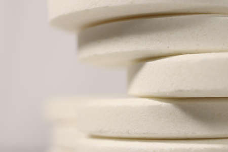 Big White Medicine Tablets Stack. Pharmacy Pills Background with Place for Text. Macro Closeup.の写真素材