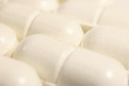 White Medicine Tablets Rows. Pharmacy Pills Background. Macro Closeup.