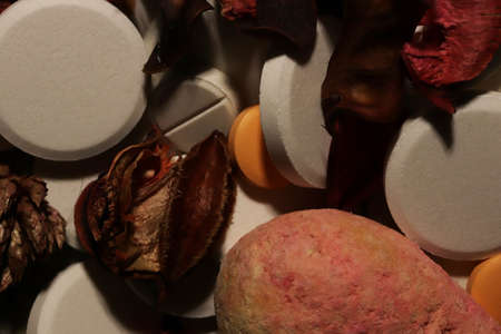 Medicine Tablets with Dry Flowers. Pharmacy Pills Background. Macro Closeup.