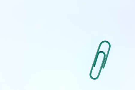 One Colored Isolated Paper Clips. Office Stationery Equipment Background.の写真素材