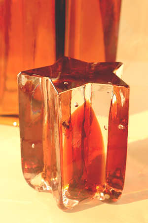 The glass star. The shape of a star made of colored crystal.
