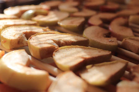 Sweet healthy dried apples. Dry apples stack. Macro closeup.の写真素材