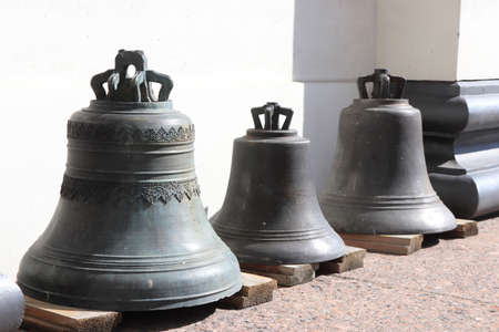 Three bells on wooden planks. Trinity Izmailovsky Cathedral. Cathedral of the Holy Life-Giving Trinity of the Life Guards Izmailovsky Regiment. Saint-Petersburg.の写真素材