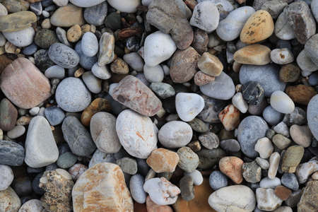 Sea pebble cobblestones texture. Marine mineral beauty harmony. Beach stones surface.