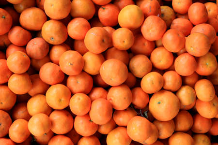 Tangerines texture. Mandarin showcase background.の写真素材