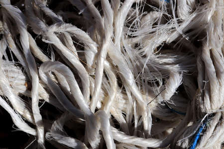 Crumpled sea sling fibers. Nautical marine background. Macro closeup.