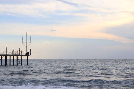 Fisherman on the pier. Black Sea landscape. Alanya. Turkey.の写真素材