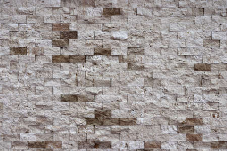 Different stone tiles background. Rocky cliff tile wall texture.