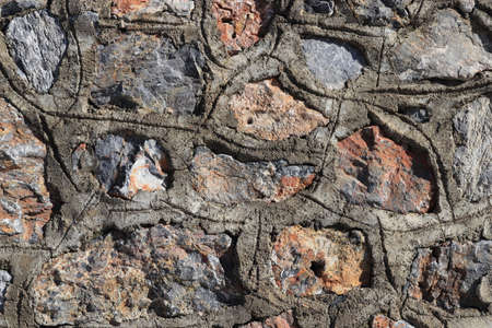 Cobblestones wall with concrete texture