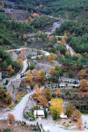 Mountain winding road with forest landscapeの写真素材