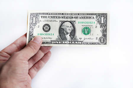In hand dollars money stack. Isolated United States of America dollars banknotes.