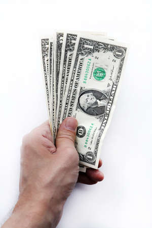 In hand United States of America money stack. Isolated dollars banknotes.