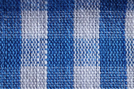 Blue white checkered color fabric background. Colored textile texture.の写真素材