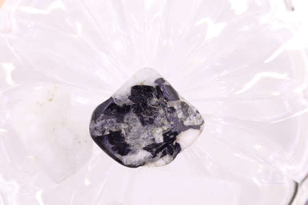 Moon stone heap jewel on half white light texture. Pile mineral pebbles background. Place for text.の写真素材