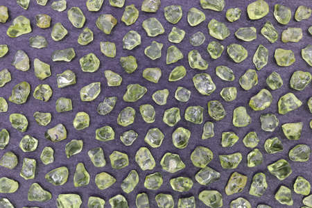 Olivine jewel heap texture on white light background.の写真素材