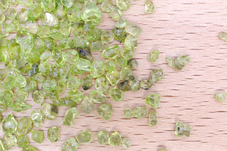 Olivine jewel heap texture on white light background.