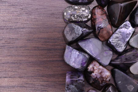 Sugilite jewel stone texture on black stone background. Macro closeup.の写真素材