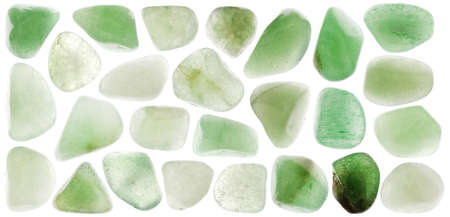 Green Aventurine rare jewel on brown varnished wood texture. Sparse mineral pebbles background.の写真素材