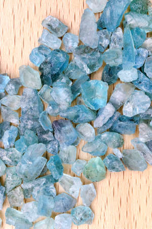 Apatite rare jewel stones filled texture on black stone background.
