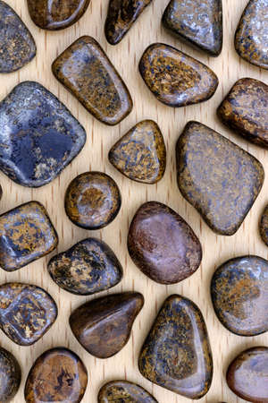 Fluorite rare jewel stones texture on brown varnished wood background