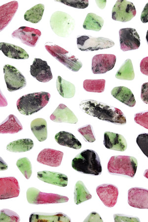 Ruby zoisite rare jewel stones texture on light white surface background.の写真素材