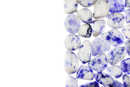 Sodalite jewel stone texture on black stone background. Macro closeup.の写真素材