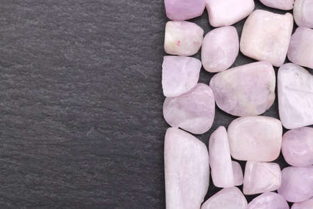 Morganite rare jewel stones texture on black background. Horizontal orientation.の写真素材