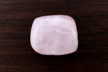 Morganite jewel stone texture on black background. Macro closeup. Horizontal orientation.