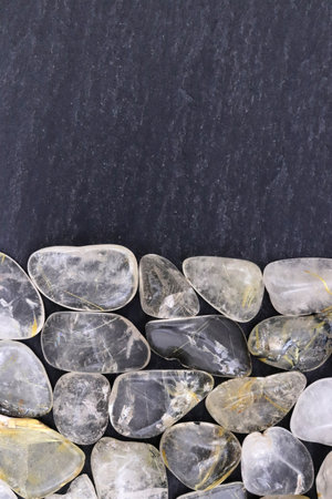 Rutilated quartz heap jewel stones texture  backgroundの写真素材