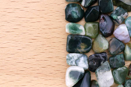 Moss agate rare jewel stones texture on white light isolated backgroundの写真素材