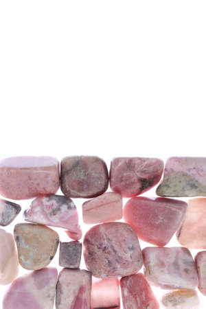 Rhodochrosite heap jewel stones filled texture on black backgroundの写真素材