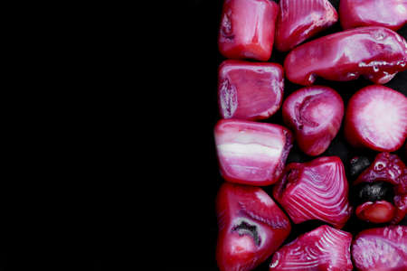 Red coral jewel stone texture on white light isolated background. Macro closeup.の写真素材