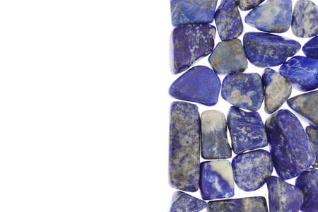 Lapis lazuli jewel stone texture on black stone background. Macro closeup.