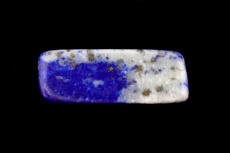 Lapis lazuli jewel stone texture on black stone background. Macro closeup.の写真素材