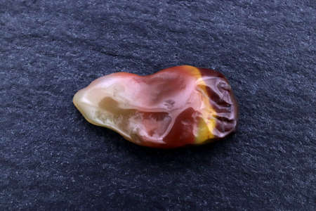 Yanyuan agate heap jewel stones texture on half white light isolated background. Place for text.の写真素材