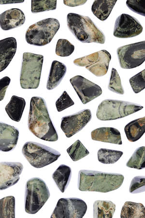 Kambaba jasper rare jewel stones texture on brown varnished wood backgroundの写真素材
