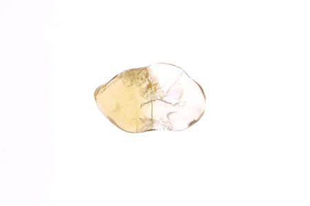 Citrine heap jewel stones texture on half white light isolated background. Place for text.