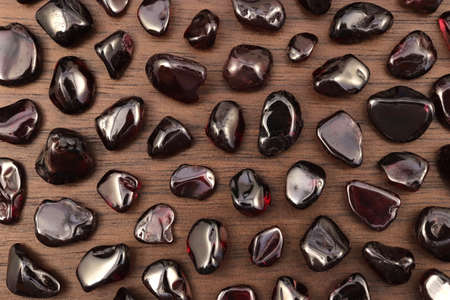Garnet heap up jewel stones texture on white light backgroundの写真素材