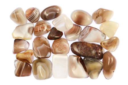 Persian agate heap jewel stones texture on half black background. Place for text.