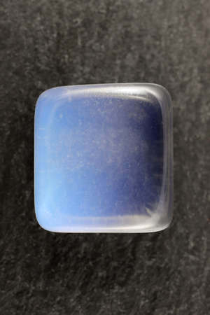 Opal jewel stones texture on white light isolated background