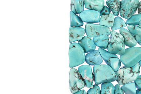 Turquoise heap jewel stones texture on half black background. Place for text.の写真素材