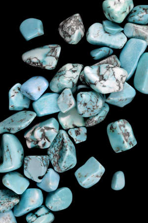 Turquoise jewel stone texture on black background. Macro closeup.の写真素材