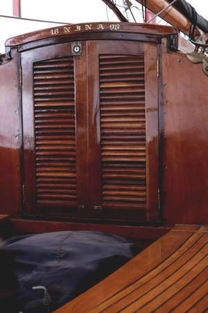 Row of rollers for ropes on a mast. marine background.