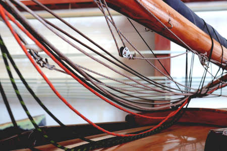 Row of rollers for ropes on a mast. marine background.