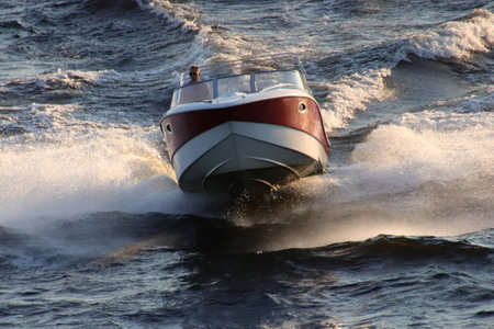 A powerful boat crosses the waters of the Neva Riverの写真素材