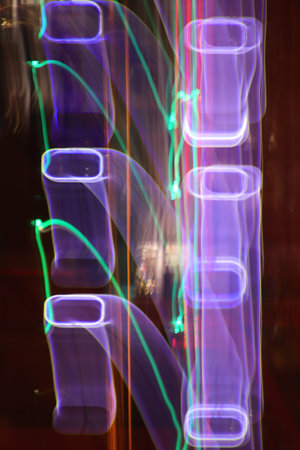 Night city rays glow background. Night exposure zoom traces. Light lines leaks exposition texture.